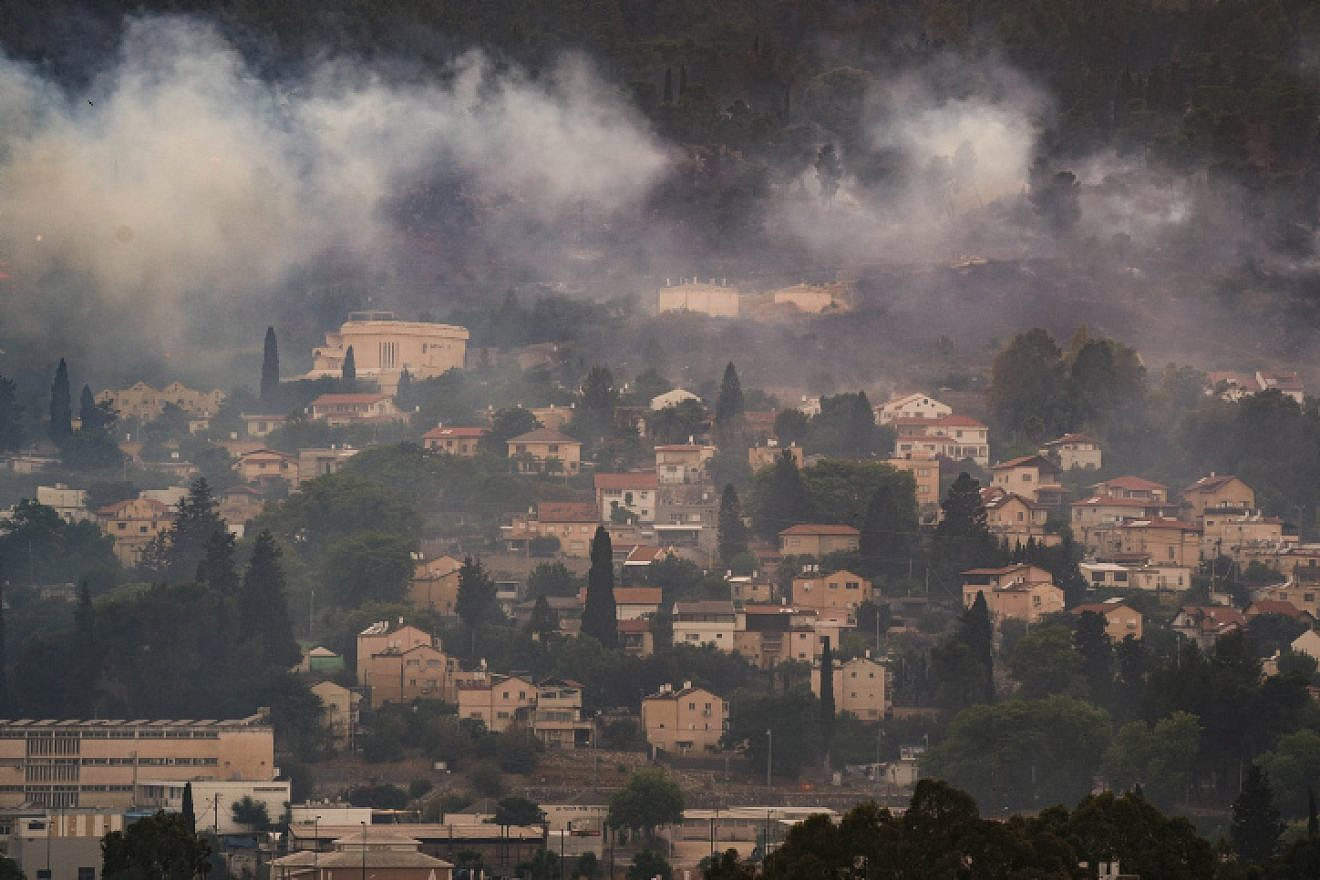 Smoke from a large fire caused by rockets fired from Lebanon, in the northern Israeli town of Kiryat Shmona, June 3, 2024. Photo by Ayal Margolin/Flash90.