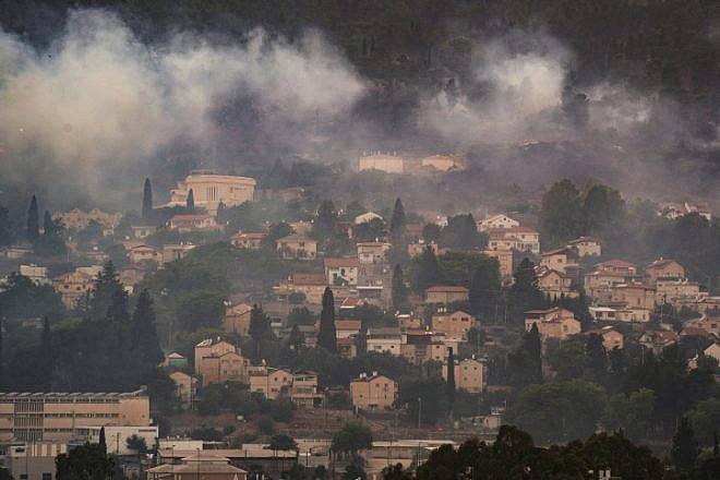 Smoke from a large fire caused by rockets fired from Lebanon, in the northern Israeli town of Kiryat Shmona, June 3, 2024. Photo by Ayal Margolin/Flash90.