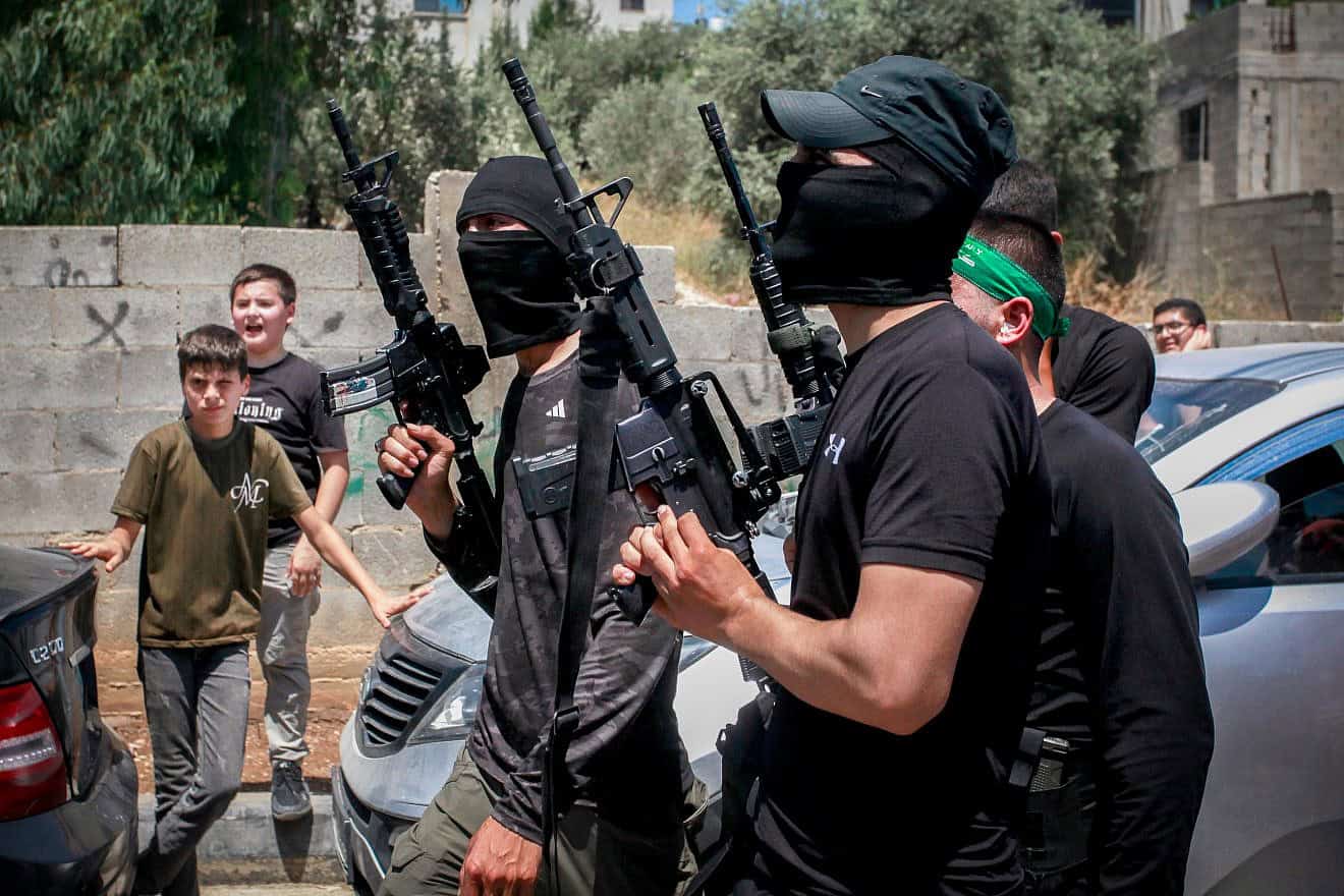 Armed Palestinians attend the funeral of terrorists killed during an Israeli military operation in Kafr Dan, west of Jenin, June 12, 2024. Photo by Nasser Ishtayeh/Flash90.