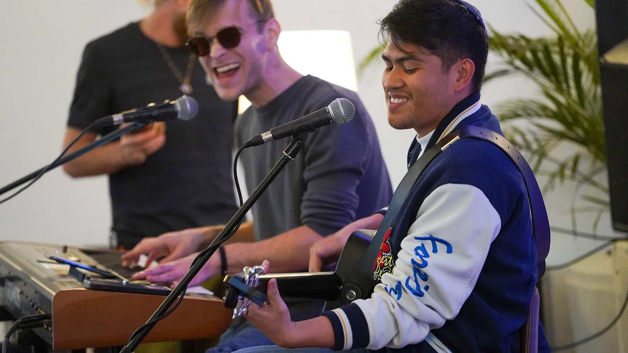 Filipino-Israeli singer Howie Danao on guitar. Credit: Courtesy.