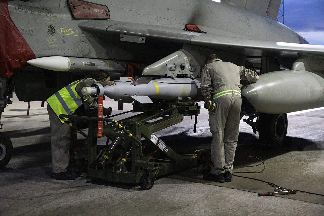 Royal Air Force weapon technicians prepare an RAF Typhoon FRG4 aircraft prior to further strikes against Houthi targets in Yemen at RAF Akrotiri on Feb. 3, 2024 in Akrotiri, Cyprus. Photo by Cpl Samantha Drummee/MoD Crown Copyright via Getty Images.