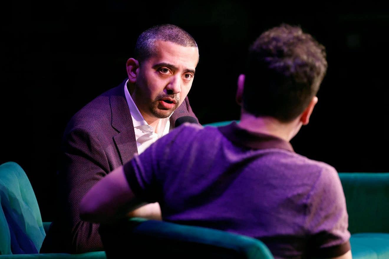 Mehdi Hasan and Jon Lovett speak onstage during a Crooked Media-Lovett or Leave It: Live on Tour event on April 25, 2024 in Washington, D.C. Credit: Paul Morigi/Getty Images.