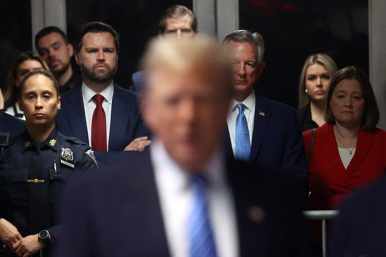 Former President Donald Trump speaks to the press at his trial for allegedly covering up hush money payments as (left, red tie) Sen. J.D. Vance (R-Ohio) looks on at Manhattan Criminal Court, in New York City, on May 13, 2024. Photo by Spencer Platt/POOL/AFP via Getty Images.