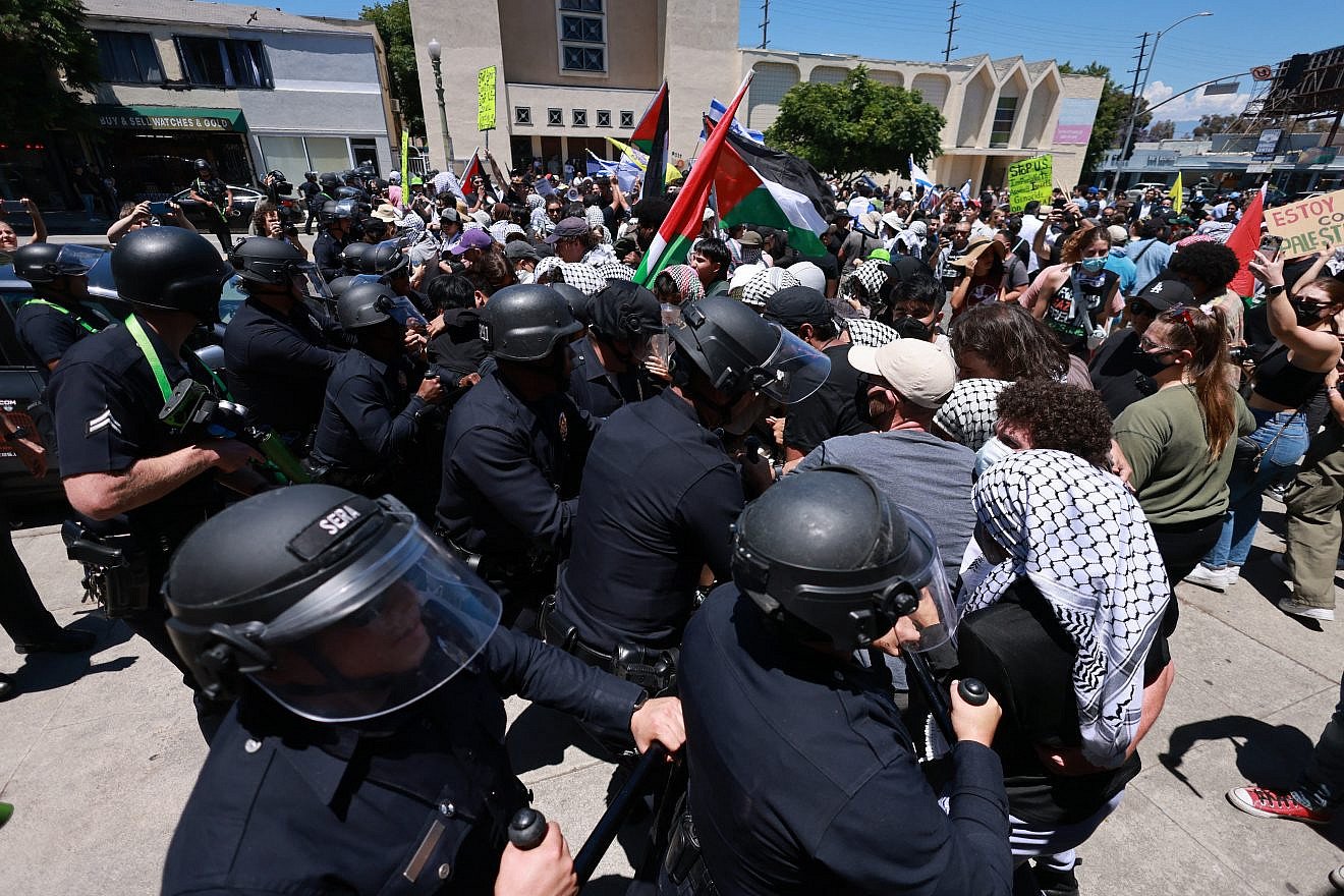 Los Angeles police officers clash with anti-Israel protesters outside Adas Torah, an Orthodox synagogue, preventing access to an event on June 23, 2024. Photo by David Swanson/AFP via Getty Images.