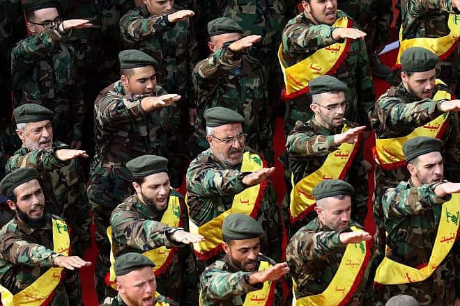 Hezbollah terrorists salute at a funeral in the southern Lebanese city of Nabatieh, Nov. 8, 2017. Credit: Mahmoud Zayyat/AFP via Getty Images.
