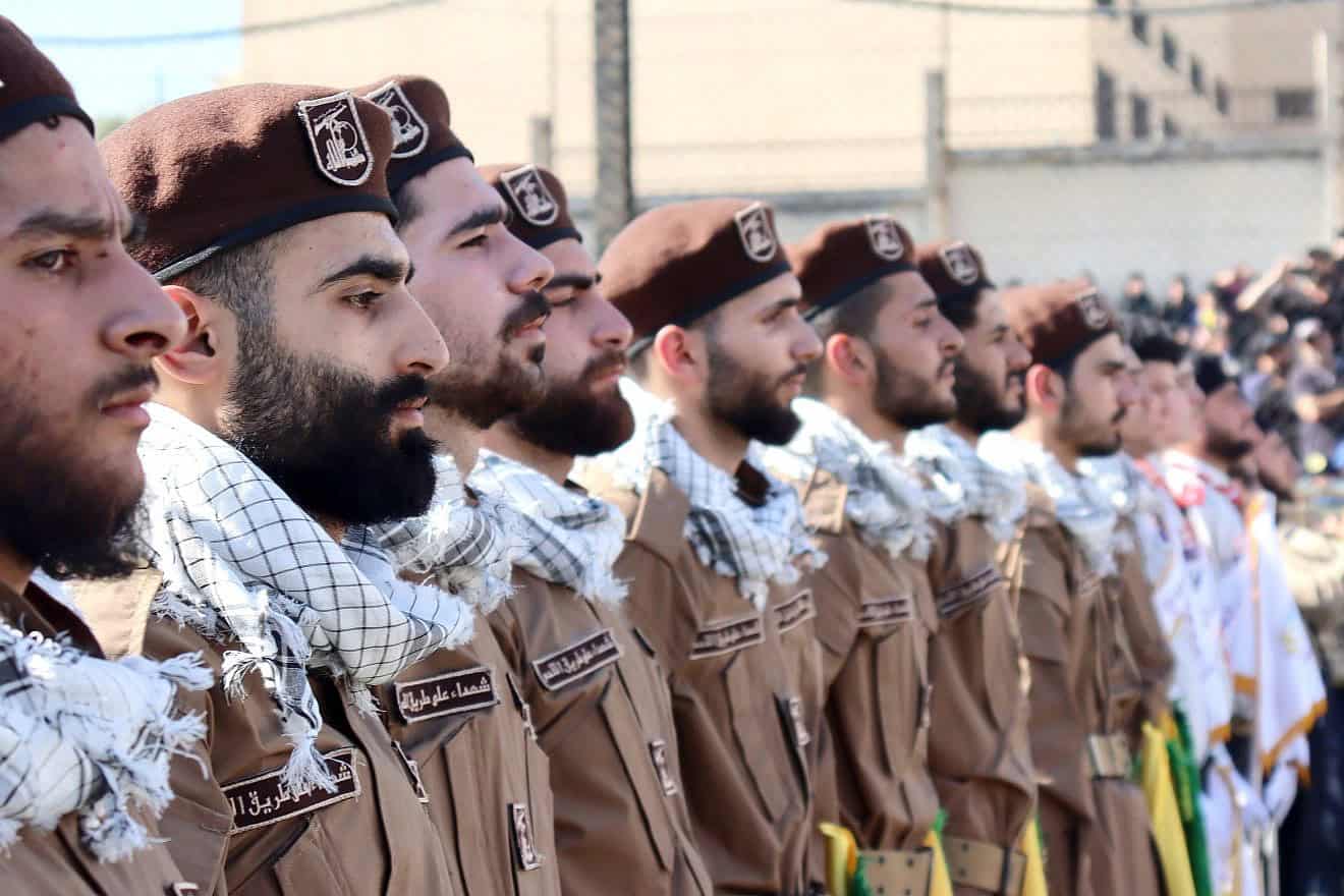 Hezbollah terrorists at a funeral for a slain comrade in Jwaya, Lebanon, April 17, ‎2024, Photo by mohammad kassir/Shutterstock.