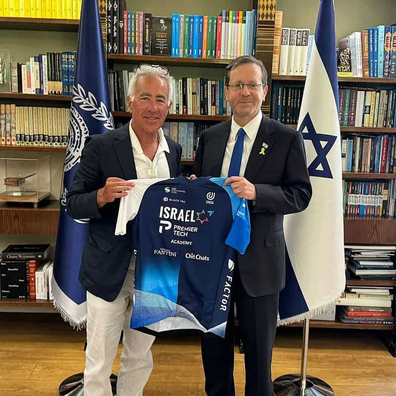 Israel-Premier Tech owner Sylvan Adams presents President Isaac Herzog with a team jersey at the President's Residence in Jerusalem, June 23, 2024. Credit: Courtesy.