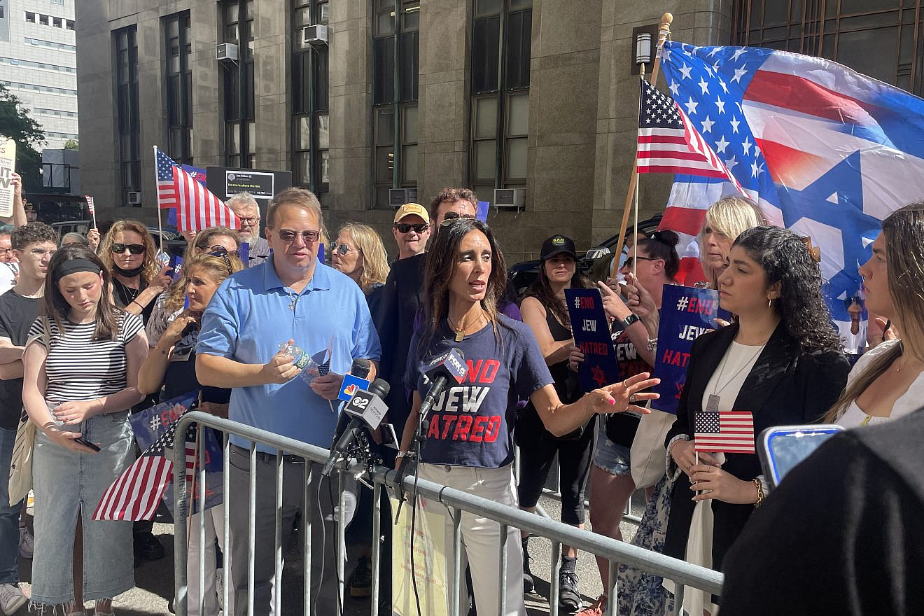 Michelle Ahdoot, director of strategy and programming at End Jew Hatred, speaks at a rally outside Manhattan District Attorney Alvin Bragg's office on June 24, 2024, alongside Alan Mindel, chairman of the board at the Holocaust Memorial and Tolerance Center of Long Island, and Eden Yadegar, president of the Columbia chapter of Student Supporting Israel. Photo by Mike Wagenheim.