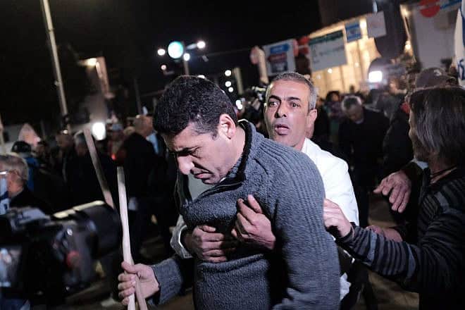 Left-wing demonstrators clash with right-wing counter-protesters in Tel Aviv, Jan. 13, 2018. Photo by Tomer Neuberg/Flash90.