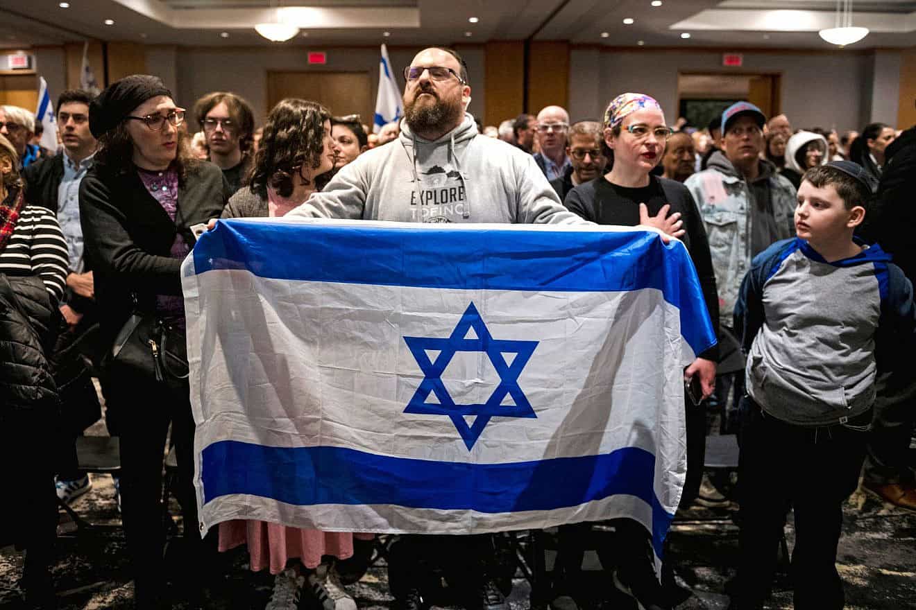 Members of Montreal's Jewish community gather for a vigil at the Gelber Conference Centre after Hamas-led terrorists invaded southern Israel, Oct. 9, 2023. Photo by Andrej Ivanov/AFP via Getty Images.