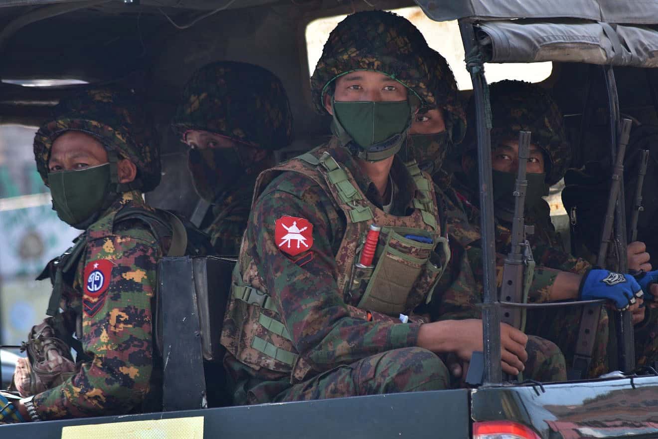 Myanmar armed forces prepare to crack down on peaceful protesters, Feb. 28, 2021. Credit: R. Bociaga/Shutterstock.