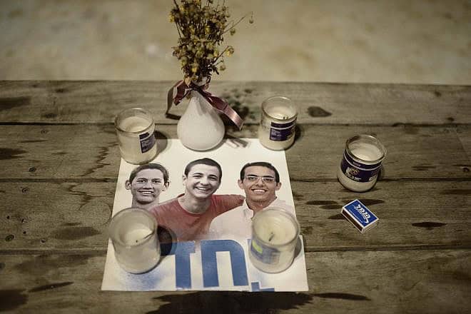 Israelis lighted candles in Tel Aviv's Rabin Square as they mourned the deaths of teenagers Naftali Fraenkel, Eyal Yifrach and Gilad Sha'ar, who were abducted and murdered by Hamas terrorists, July 6, 2014. Photo by Tomer Neuberg/Flash90.