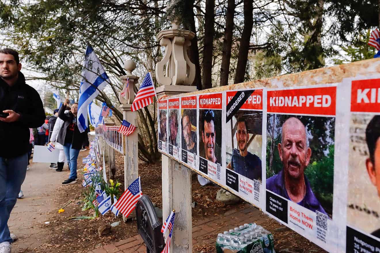 Thousands gather to rebuild a memorial in Newton, Mass., honoring those who were kidnapped and taken into the Gaza Strip by Hamas on Oct. 7, after it was vandalized on April 7, 2024. Photo by Arthur Mansavage/Shutterstock.