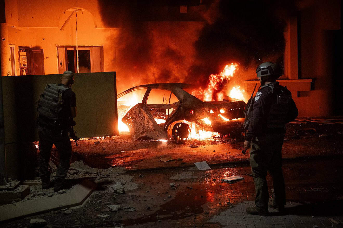 Security personnel at the scene where a Gazan rocket hit a home and a car in Sderot, Oct. 17, 2023. Photo by Yonatan Sindel/Flash90.