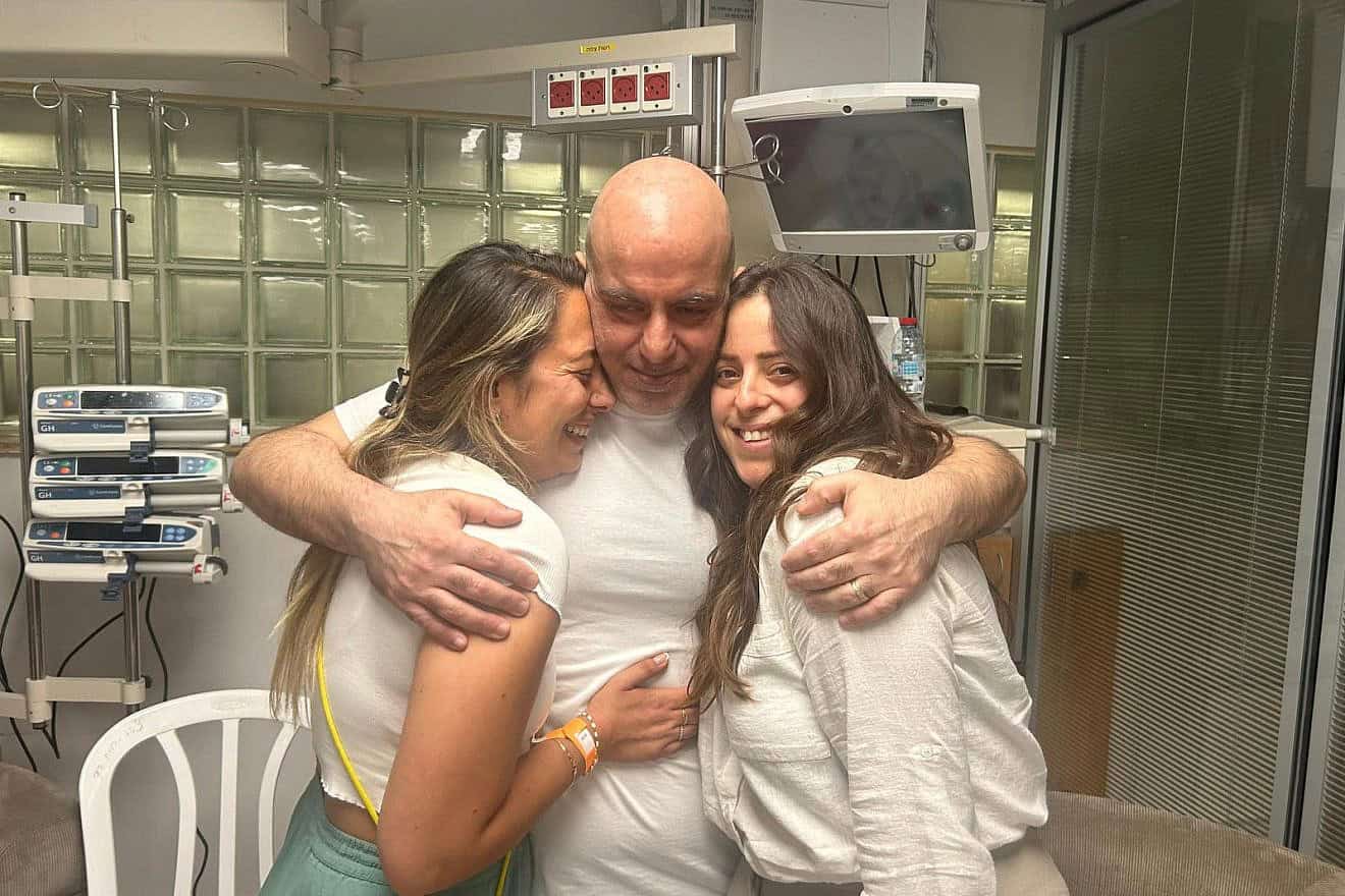 Former hostage Shlomi Ziv in a first embrace with his sister Revital Nasi (left) and cousin Liat Ariel. Credit: Courtesy of the Hostage and Missing Families Forum.