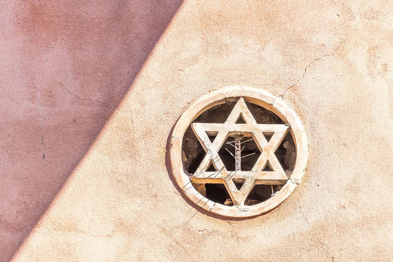 A Star of David embedded in the wall of a medieval synagogue in Taormina, a hilltop town on the coast of Sicily, Italy. Credit: Jon Shore/Shutterstock.