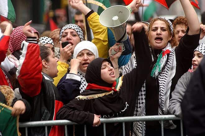 Pro-Palestinian demonstrators chant anti-Israel slogans in Times Square, New York City, on April 12, 2002. Photo by Spencer Platt/Getty Images.