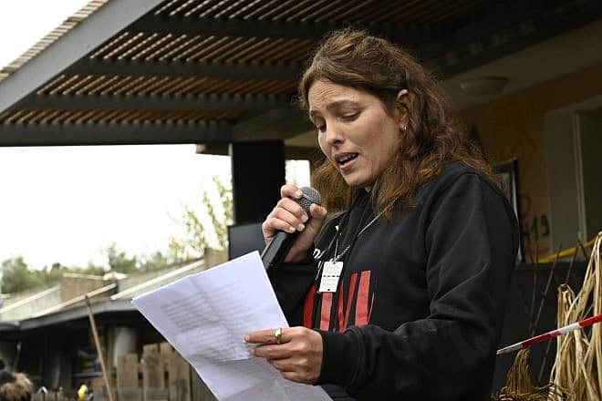 Released hostage Amit Soussana in front of her destroyed home in Kibbutz Kfar Aza, southern Israel, Jan. 29, 2024. Photo by Paulina Patimer.