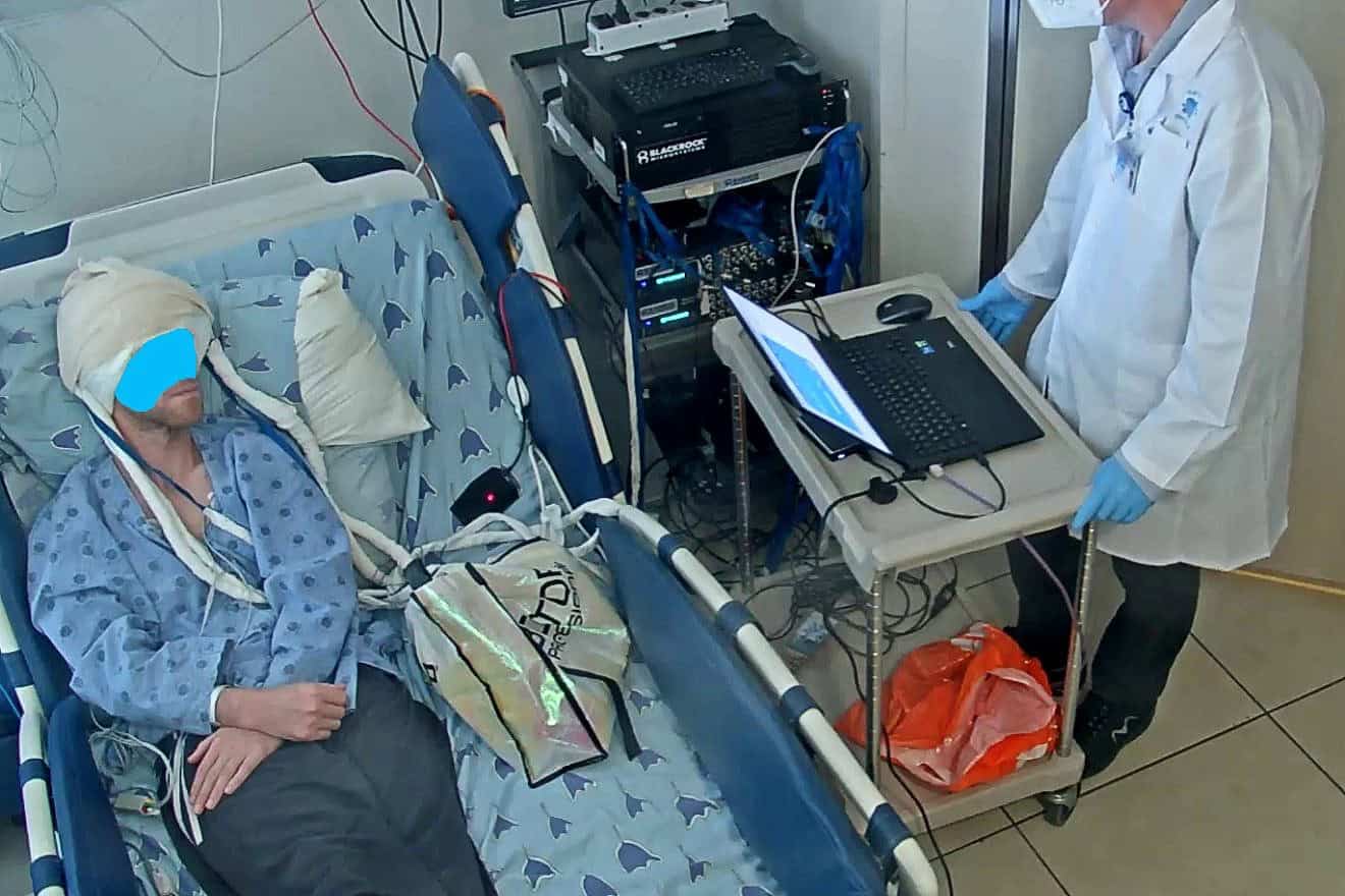 An image from the experiment of the speech neuroprosthesis (a.k.a speech brain-computer interface). It shows the participant who is completely silent, with his mouth closed, imagining saying a syllable. Credit: Tel Aviv University.