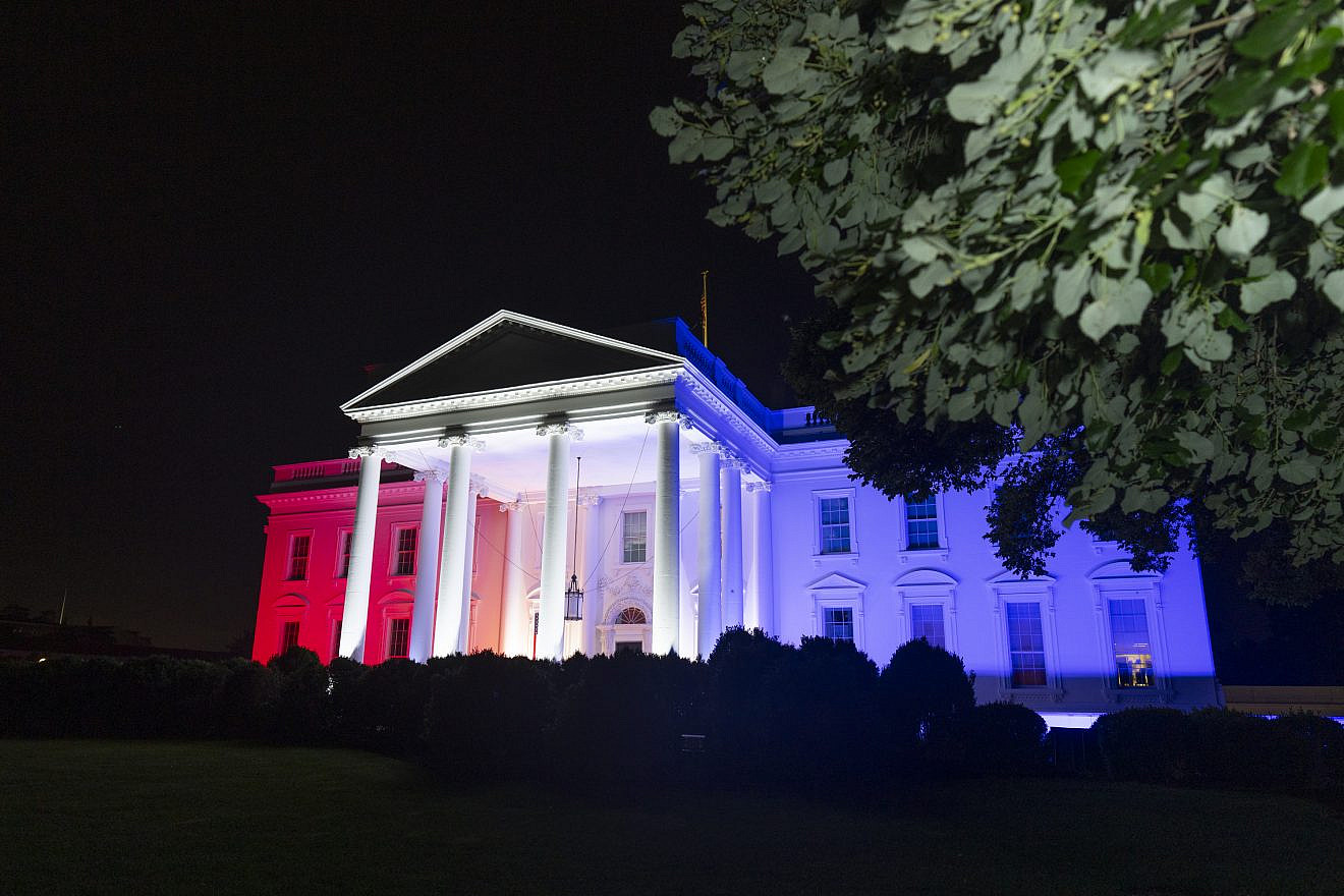 Red, white and blue lanterns and lights are seen on the north portico of the White House during the Fourth of July celebration, July 4, 2024. Credit: Oliver Contreras/White House.