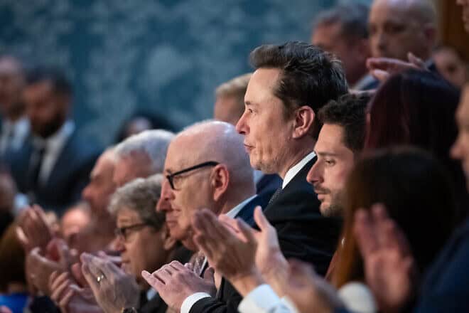 Elon Musk (center right) and other guests applaud Israeli Prime Minister Benjamin Netanyahu during his address to a joint session of Congress in Washington, D.C., on July 24, 2024. Photo by Allison Bailey/Middle East Images/AFP via Getty Images.