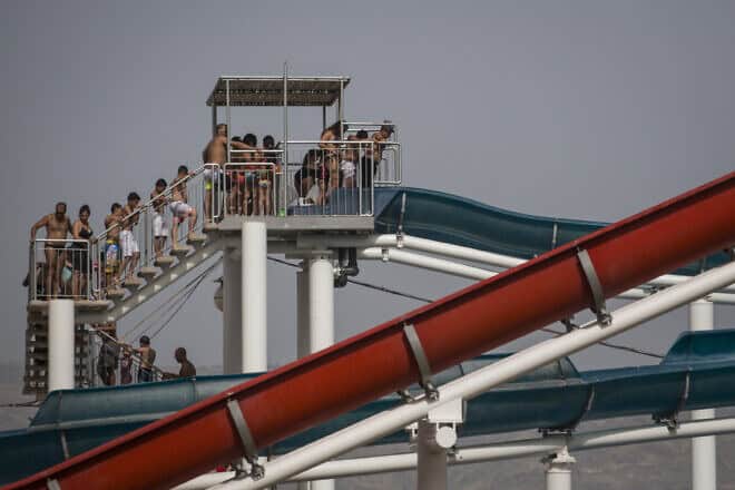 Israeli children line up to ride a slide in a water park by the Kinneret, the Sea of Galilee in northern Israel, during the Jewish holiday of Passover on April 26, 2016. Photo by Hadas Parush/Flash90.
