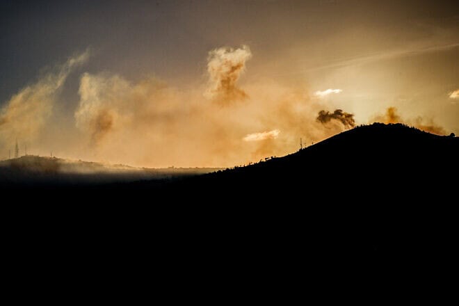 Smoke rises during an exchange of fire between the Israel Defense Forces and Hezbollah terrorists on the Lebanese border, Nov. 10, 2023. Photo by Ayal Margolin/Flash90.