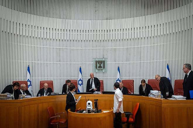 Acting President of the Israeli Supreme Court Uzi Vogelman and fellow justices arrive at a hearing in Jerusalem on June 18, 2023. Credit: Yonatan Sindel/Flash90.