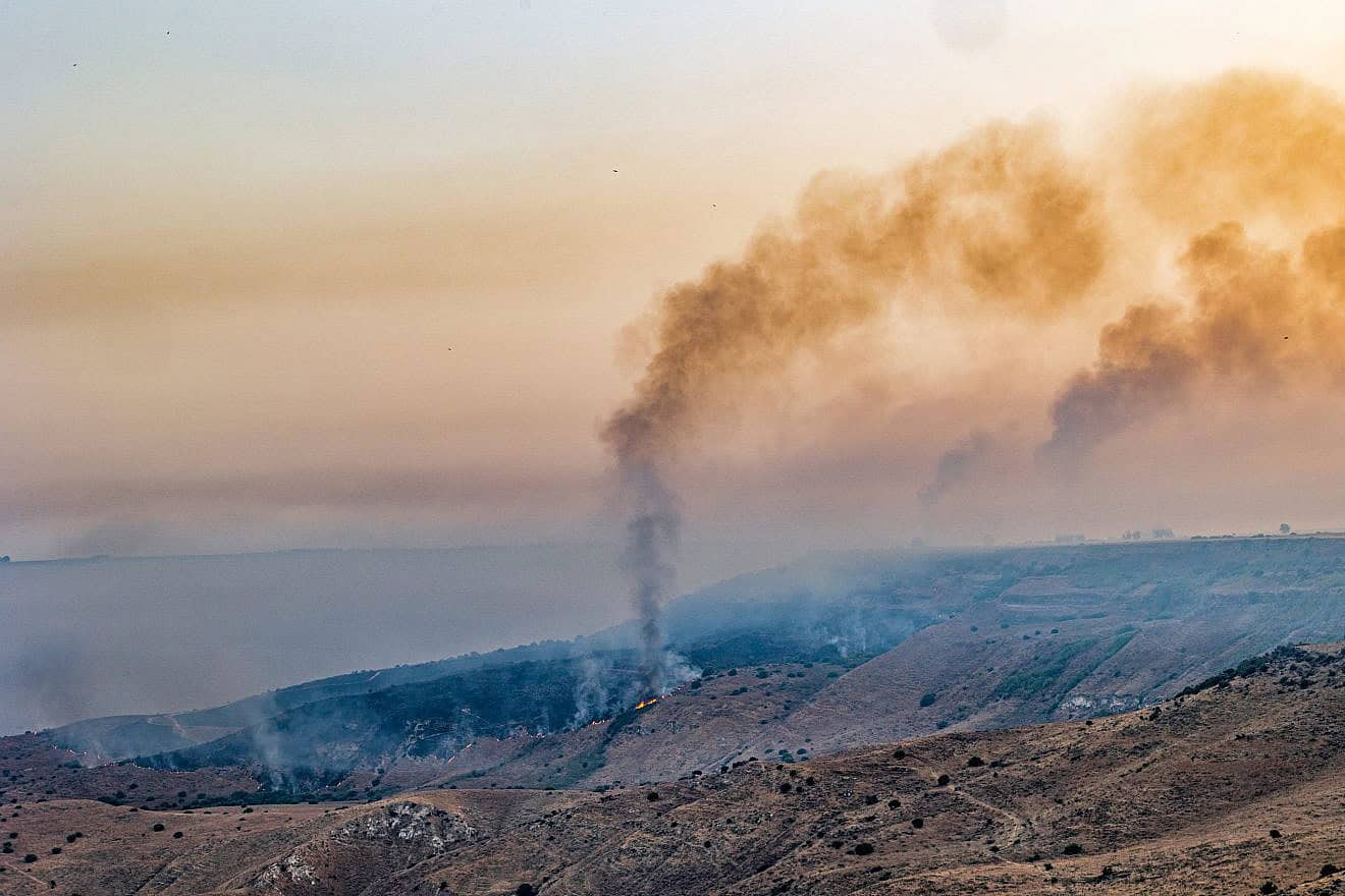 Smoke and fire rises after attacks from Lebanon at the El Al stream in the Golan Heights, July 5, 2024.  Photo by Maor Kinsbursky/Flash90.