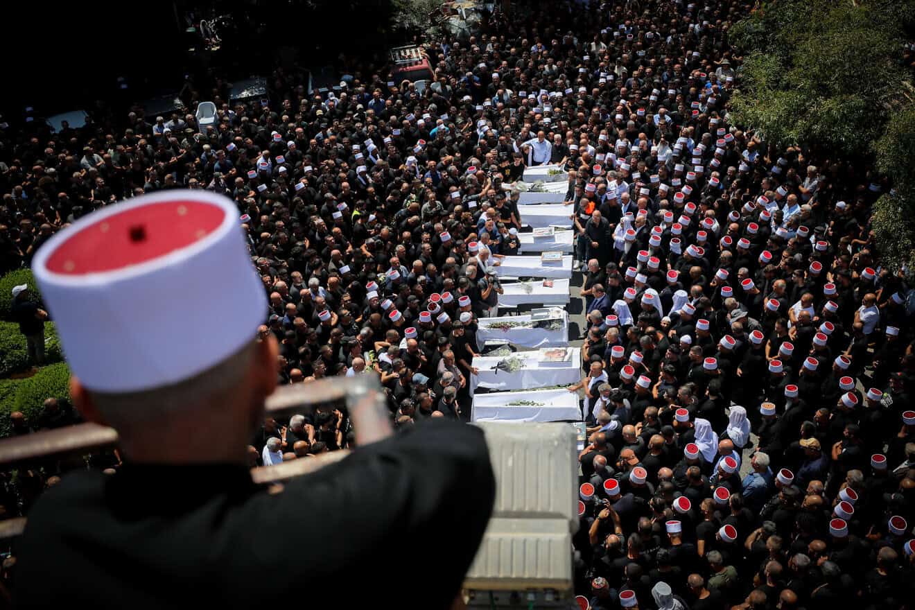 Family and friends attend the funeral service of Druze children who were killed at a soccer field from a missile fired from Lebanon, in the Druze village of Majdal Shams, in the Golan Heights, July 28, 2024. Photo by Jamal Awad/Flash90.