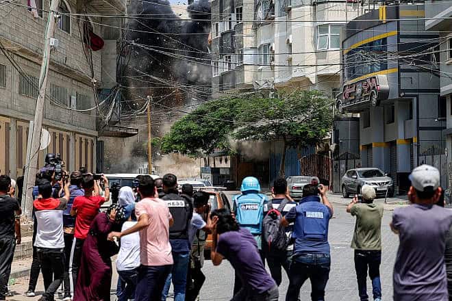 Journalists during an Israeli airstrike in Gaza City amid the conflict with Iran-backed Palestinian Islamic Jihad, Aug. 6, 2022. Photo by Mohammed Abed/AFP via Getty Images.
