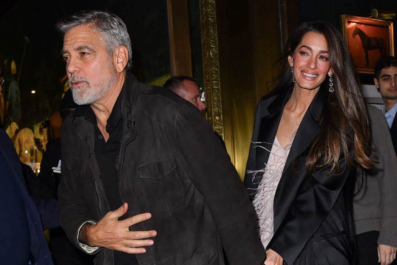 George Clooney and Amal Clooney leave the Polo Bar in New York City on Dec. 14, 2023. Credit: James Devaney/GC Images.