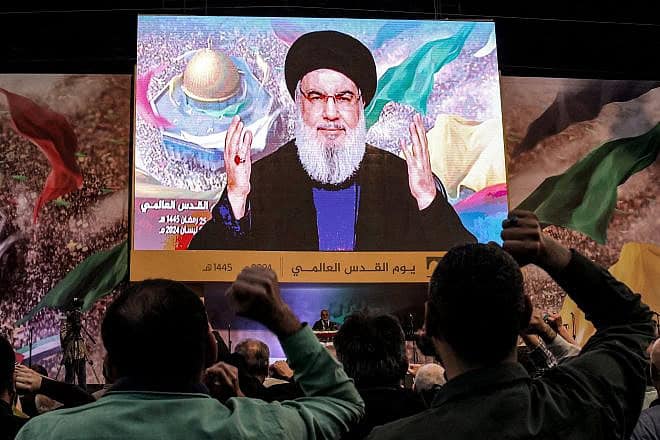 Hezbollah Secretary-General Hassan Nasrallah delivers a televised speech during a gathering to mark annual Quds (Jerusalem) Day commemorations in south Beirut on April 5, 2024. Photo by Anwar Amro/AFP via Getty Images.