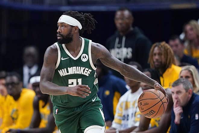 Patrick Beverley #21 of the Milwaukee Bucks dribbles the ball in the first quarter against the Indiana Pacers during game six of the Eastern Conference First Round Playoffs at Gainbridge Fieldhouse on May 2, 2024 in Indianapolis, Indiana. Photo by Dylan Buell/Getty Images.
