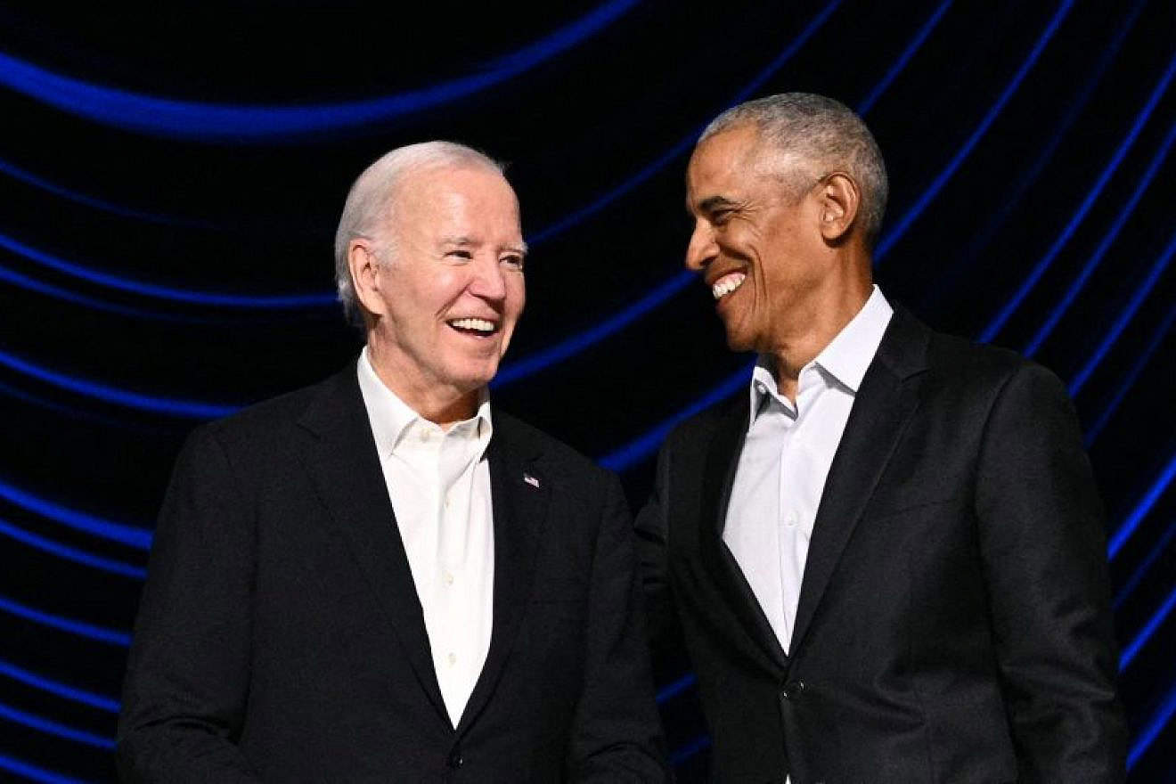 U.S. President Joe Biden laughs with former President Barack Obama during a campaign fundraiser at the Peacock Theater in Los Angeles on June 15, 2024. Credit: Mandel Ngan / AFP via Getty Images.