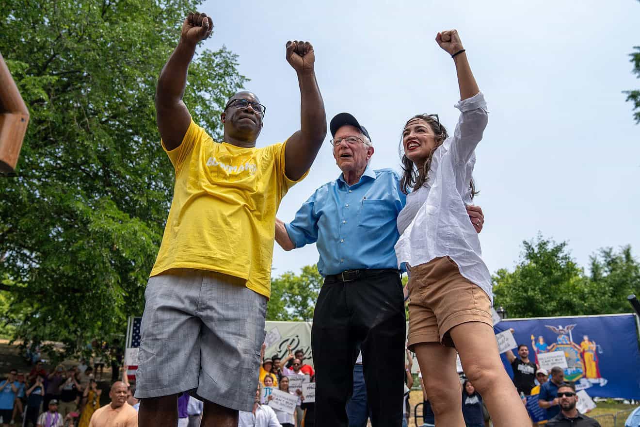 Rep. Jamaal Bowman (D-N.Y.), Sen. Bernie Sanders (I-Vt.), and Rep. Alexandria Ocasio-Cortez (D-N.Y.) attend a rally at St. Mary's Park in the Bronx, N.Y., on June 22, 2024. Photo by David Dee Delgado/Getty Images.