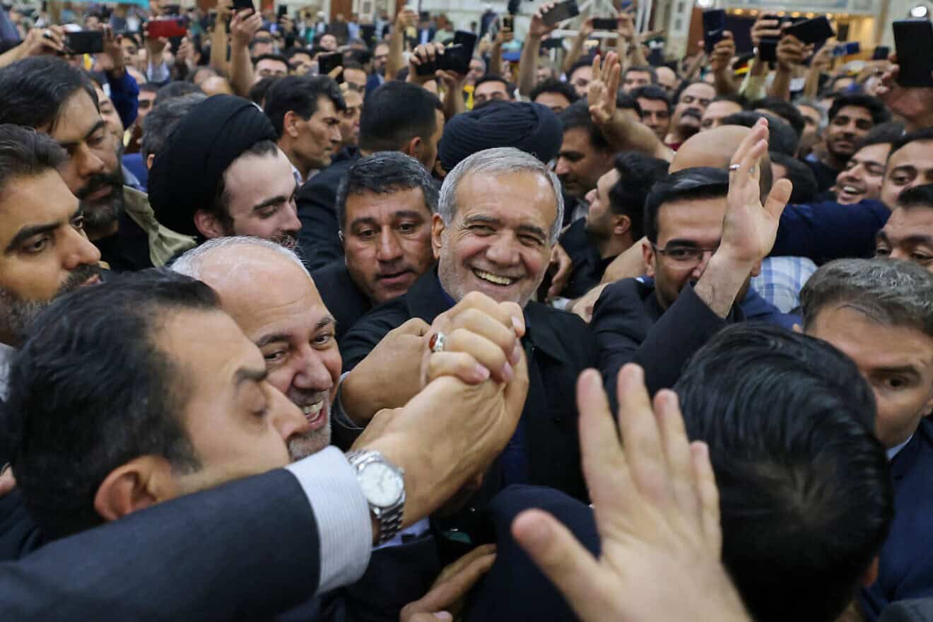 Supporters cheer as newly elected Iranian President Masoud Pezeshkian arrives at the shrine of the Islamic Republic's founder Ayatollah Ruhollah Khomeini in Tehran on July 6, 2024. Credit: Atta Kenare / AFP via Getty Images.