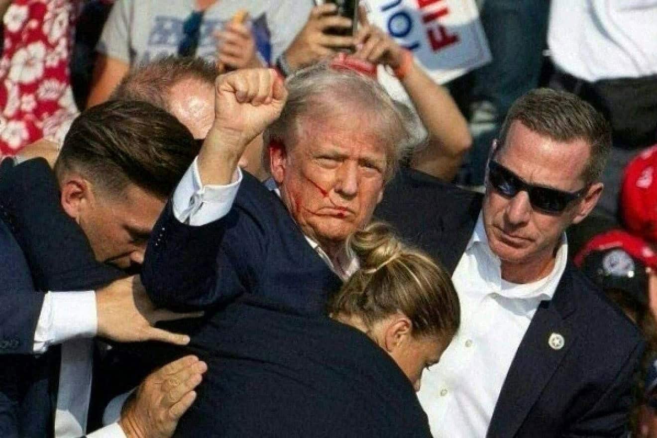 Donald Trump is rushed offstage during a rally in Butler, Pa., on July 13, 2024. Photo by Rebecca Droke/AFP via Getty Images.