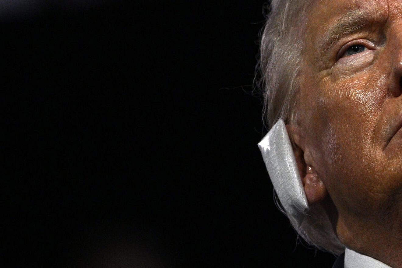 A bandage is seen on the ear of former President and 2024 Republican presidential candidate Donald Trump after he was wounded in an assassination attempt, July 15, 2024. Credit: Brendan Smialowski / AFP via Getty Images.