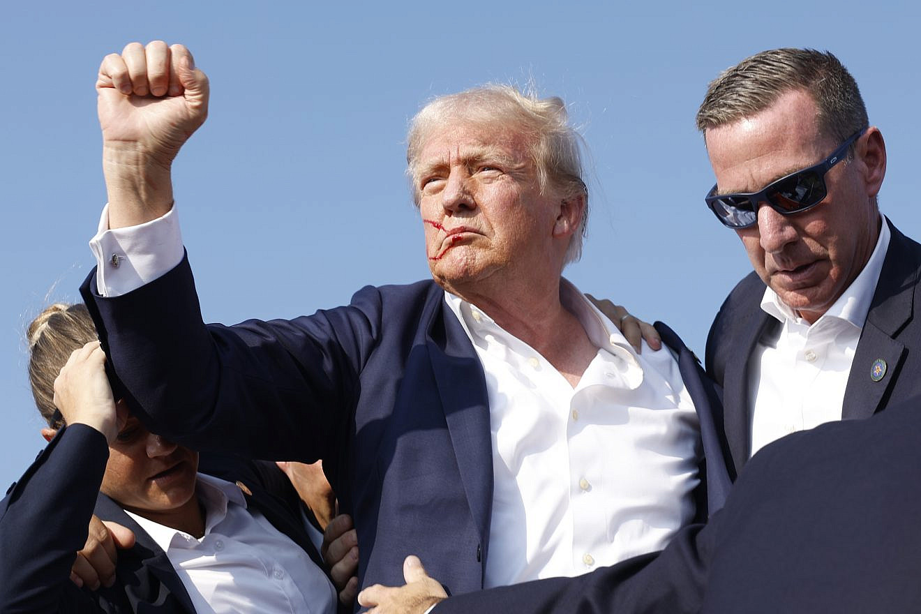 Republican presidential candidate and former President Donald Trump is rushed offstage during a rally in Butler, Pa., on July 13, 2024. Photo by Anna Moneymaker/Getty Images.