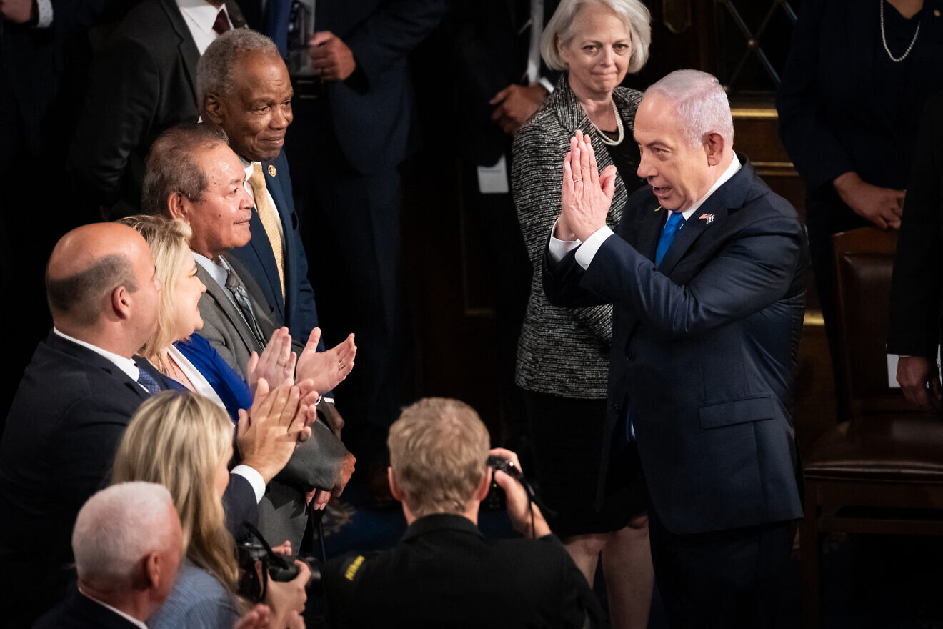 Israeli Prime Minister Benjamin Netanyahu thanks members of Congress for their applause prior to addressing a joint session of Congress on July 24, 2024. Photo by Allison Bailey/Middle East Images/AFP via Getty Images.