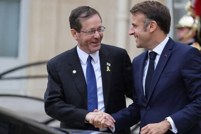French President Emmanuel Macron greets Israeli President Isaac Herzog at the Élysée presidential palace in Paris, July 26, 2024. Photo by Ludovic Marin/AFP via Getty Images.