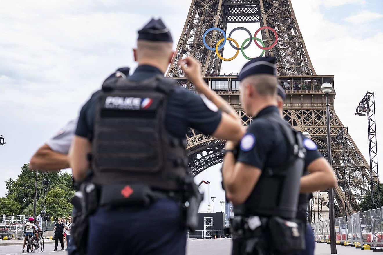 French police patrol the Eiffel tower ahead of Paris 2024 Olympic Games on July 20, 2024 in Paris, France. Photo by Kevin Voigt/GettyImages.