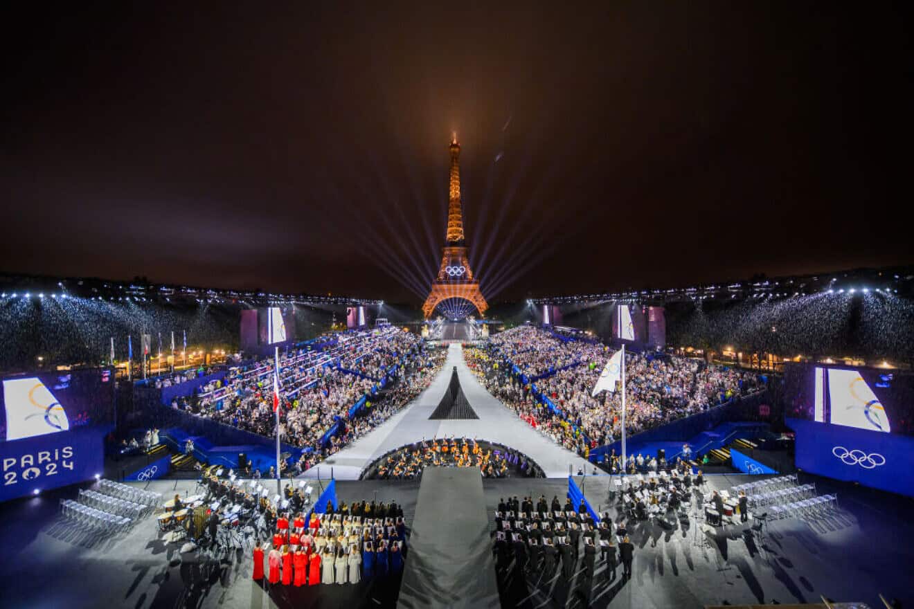 The Olympic flag is raised at the Place du Trocadero in front of the Eiffel Tower during the opening ceremony of the Olympic Summer Games in Paris on July 26, 2024. Photo by François-Xavier Marit-POOL/Getty Images.