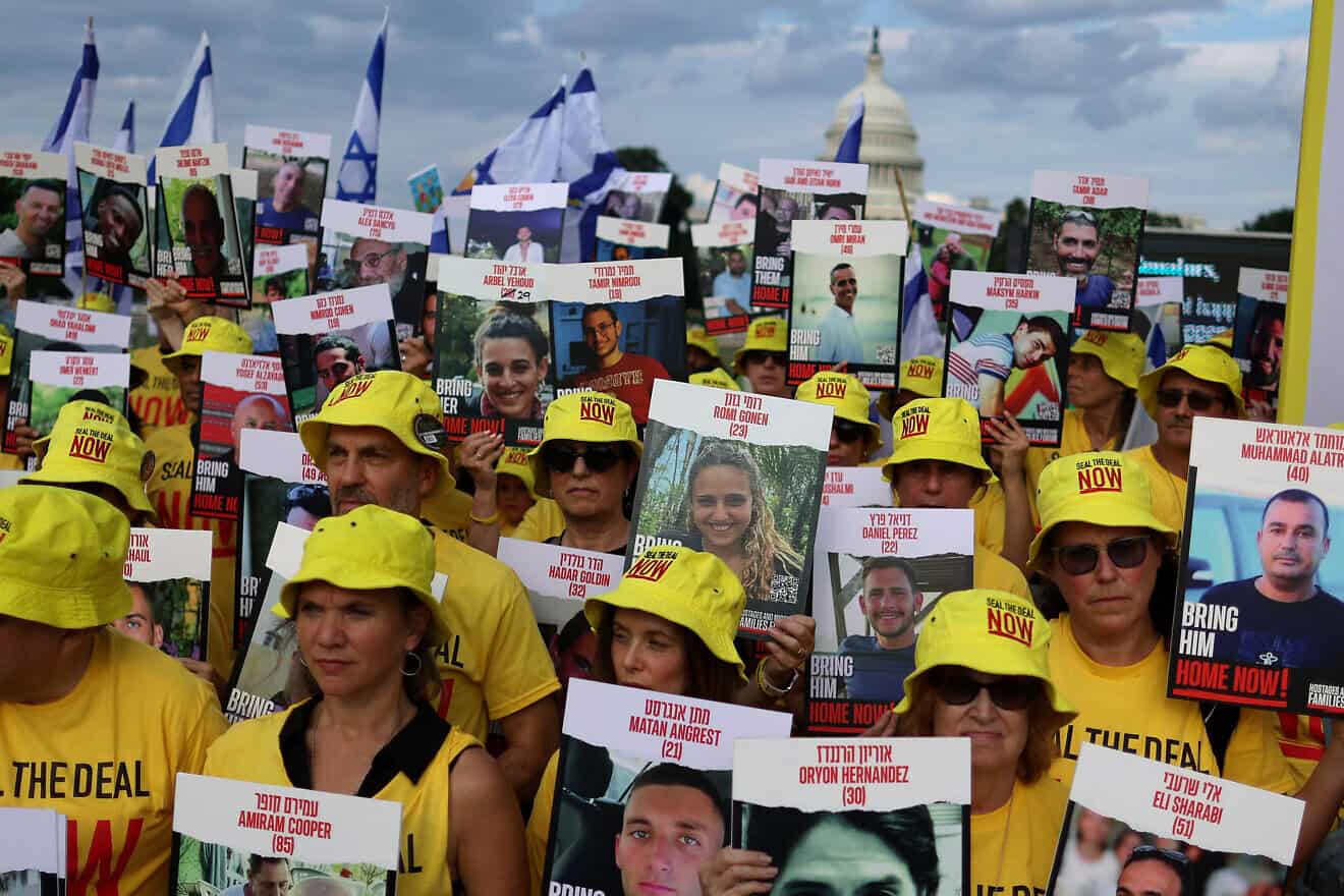 People hold pictures of Israeli hostages during a vigil on the National Mall on July 23, 2024 in Washington, DC. Photo by Justin Sullivan/Getty Images.