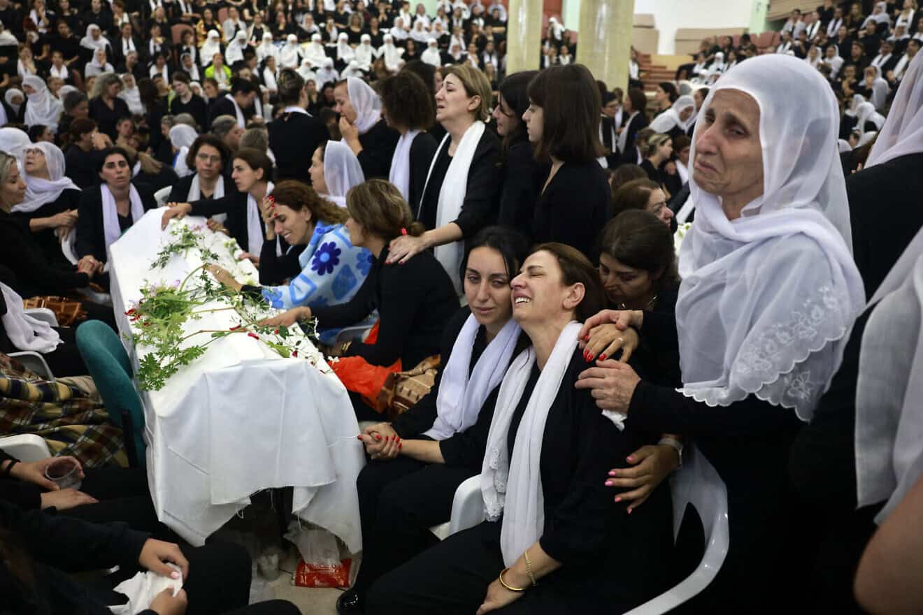 Druze women mourn one of the 12 young victims of a Hezbollah missile strike on the Druze town of Majdal Shams in the Golan Heights a day earlier,  July 28, 2024. Photo by Menahem Kahana/AFP via Getty Images.