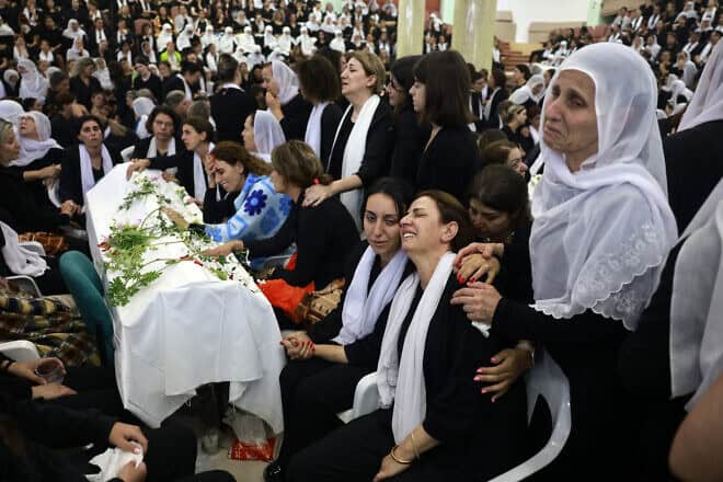 Druze women mourn one of the 12 young victims of a Hezbollah missile strike on the Druze town of Majdal Shams in the Golan Heights a day earlier,  July 28, 2024. Photo by Menahem Kahana/AFP via Getty Images.