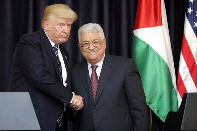 US President Donald Trump (L) and Palestinian leader Mahmoud Abbas shake hands during a joint press conference at the presidential palace in Bethlehem on May 23, 2017. Photo by THOMAS COEX/AFP via Getty Images.