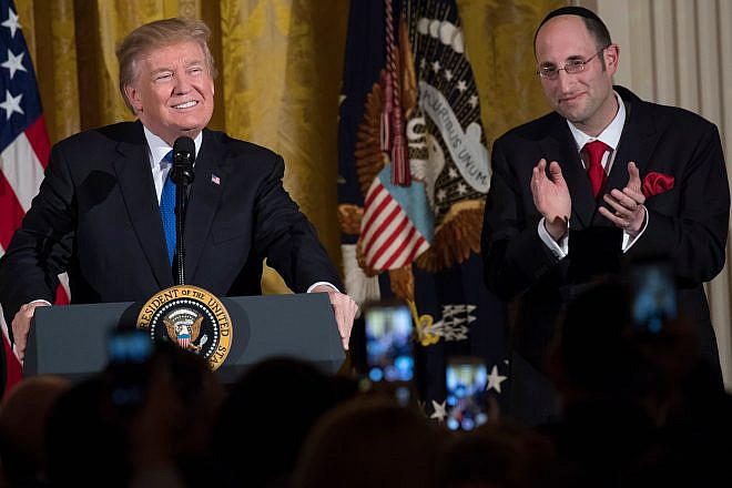 U.S. President Donald Trump speaks alongside Rabbi Meir Soloveichik at a Chanukah reception in the East Room of the White House on Dec. 7, 2017. Photo by Saul Loeb/AFP via Getty Images.