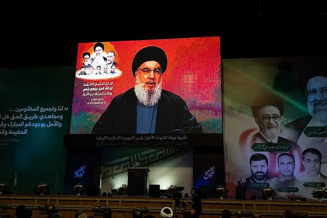 Lebanese watch a televised speech by Hezbollah Secretary General Hassan Nasrallah in a hanger in the Beirut suburb of Dahiyeh following the death of Iranian President Ebrahim Raisi in a helicopter crash, May 24, 2024. Photo by Oliver Marsden/Middle East Images/AFP via Getty Images.